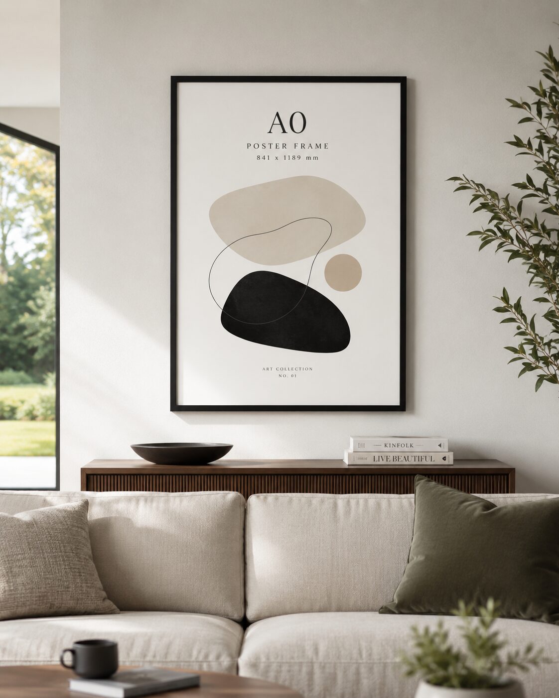 Large black A0 poster frame displayed above a sofa in a contemporary lounge